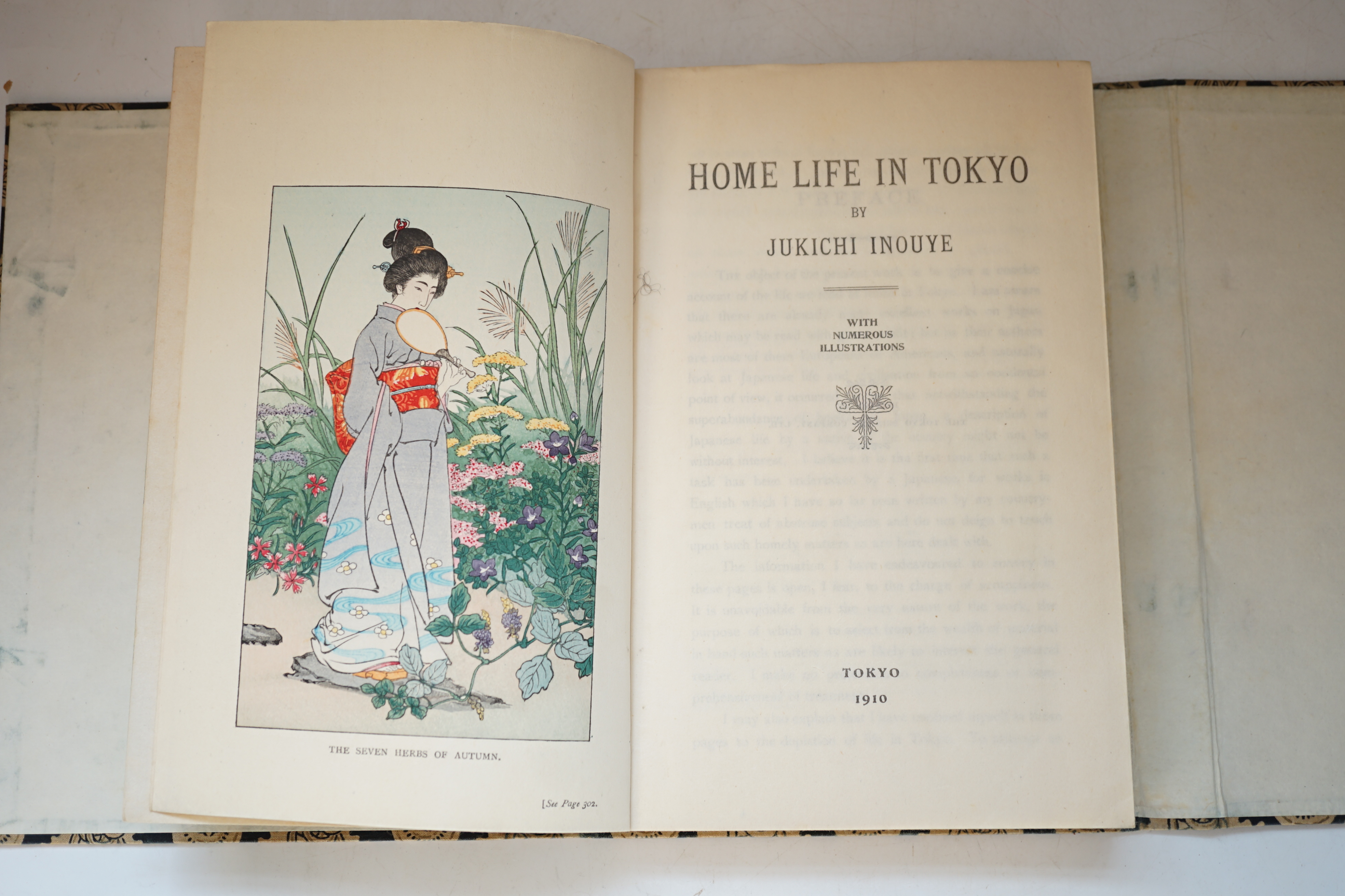 Inouye, Jukichi - Home Life in Tokyo. 1st edition, 8vo, colour woodblock frontispiece, numerous woodblock drawings. Publisher’s pictorial colour woodblock printed covers, stitched with cotton ties, front cover top right